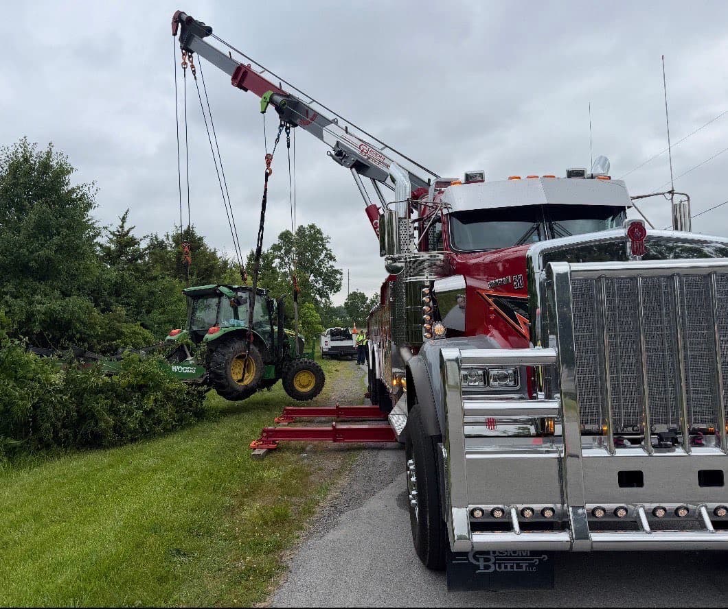 Heavy wrecker recovering John Deere tractor — Northwest Ohio